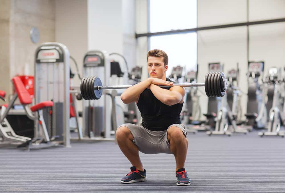 man performing a squat